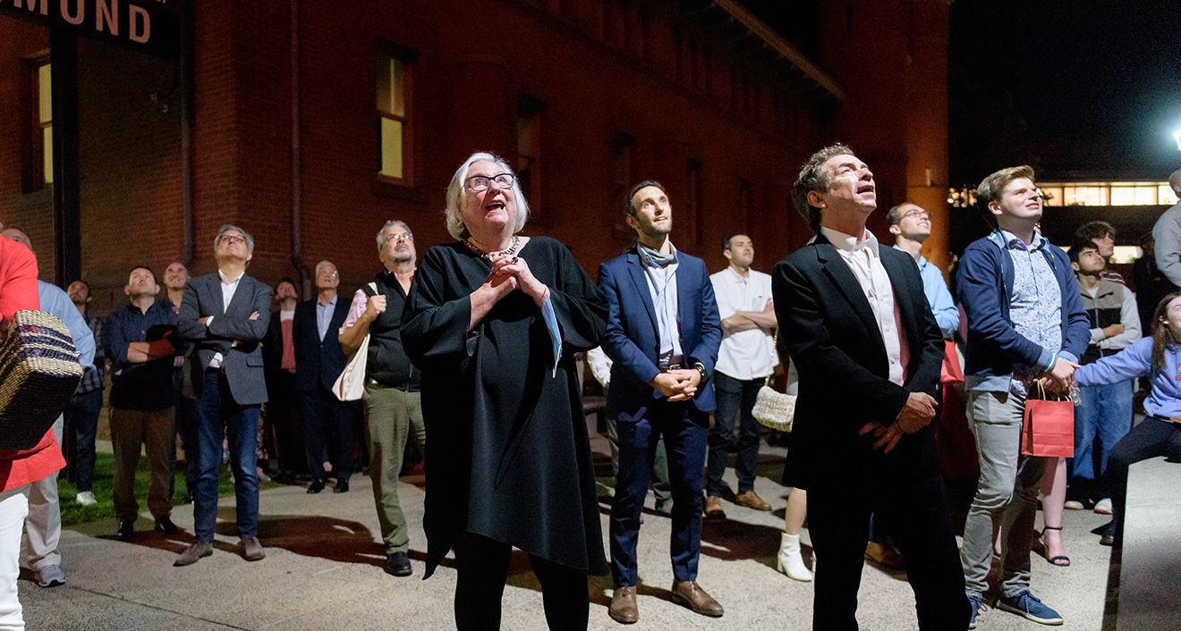 Corwin-Fuller Emerita Professor of Film Studies Jeanine Basinger, center, watches in awe during a firework show that occurred after the dedication of the Jeanine Basinger Center for Film Studies on Sept. 25. About 300 people attended the event. (Photo by Nick Caito)
