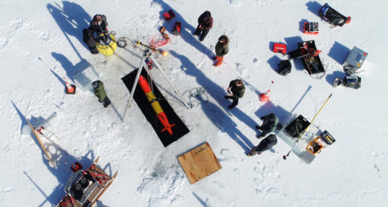 Daniel Gómez-Ibáñez specializes in the propulsion of autonomous underwater vehicles like this one launched with the Scibiotics Lab in Maine’s Bog Lake. Photo by Sean Whelan courtesy Amy Kukulya.