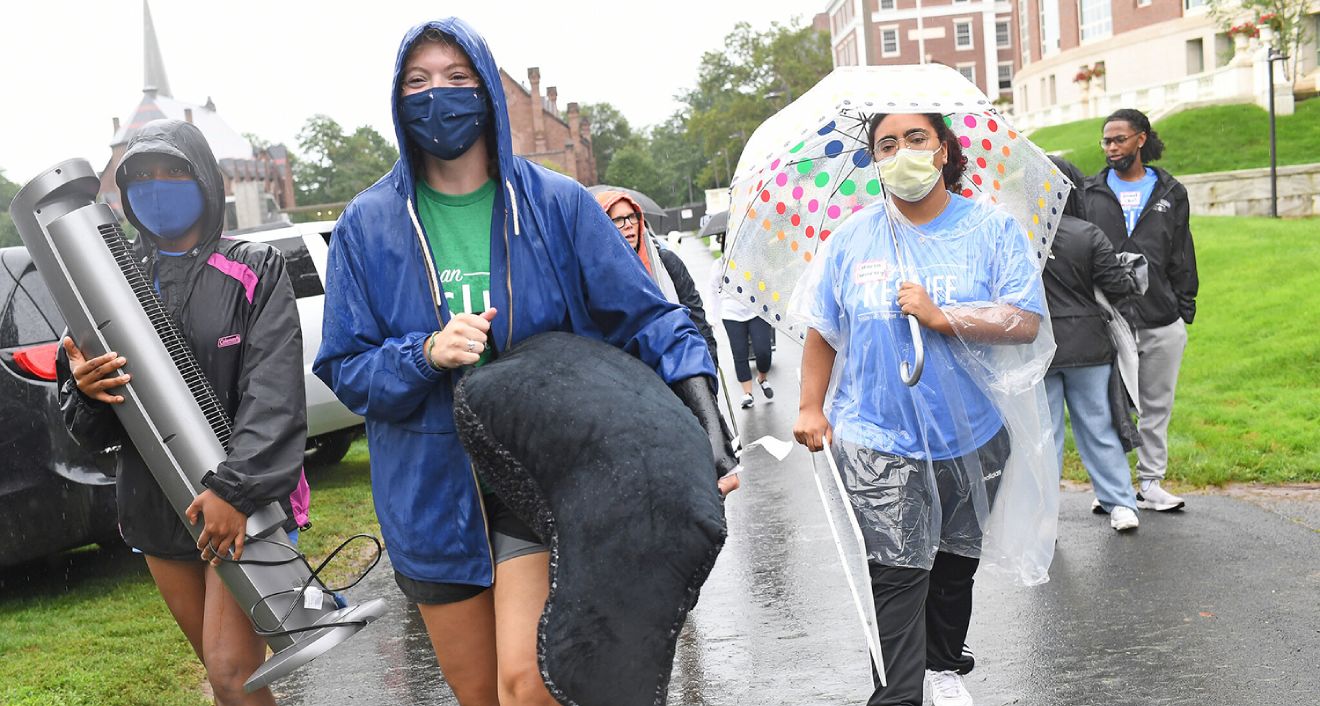 by 8: 45 a.m. on Arrival Day, parents and students started the process of moving belongings into the students’ new residences.;