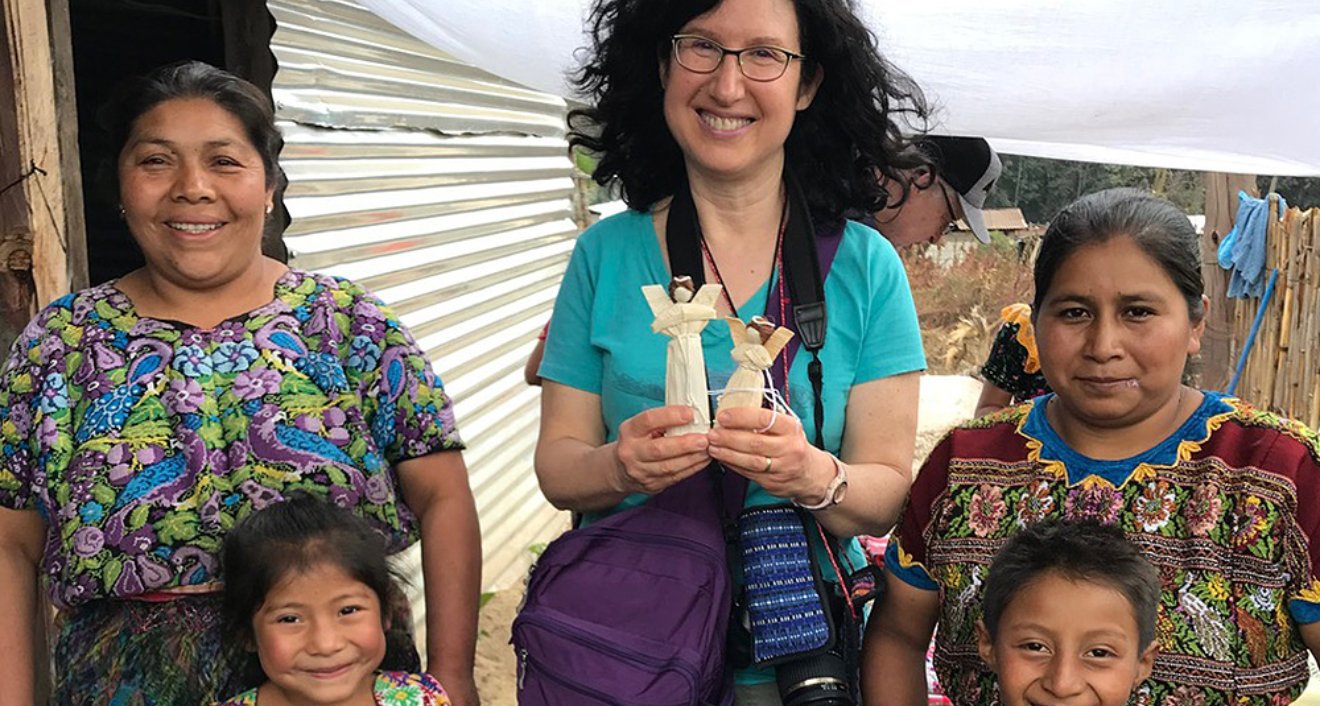 Diane Stein holds samples of the handcrafted goods created by MayaWorks.