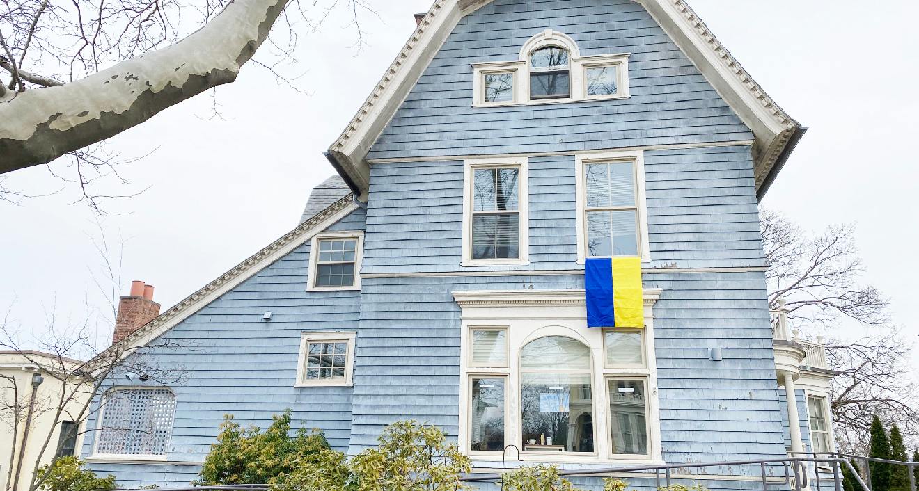 The College of the Environment, which has co-sponsored several of the recent events, displays a Ukraine flag from its building on High Street. (Photo by Laurie Kenney)