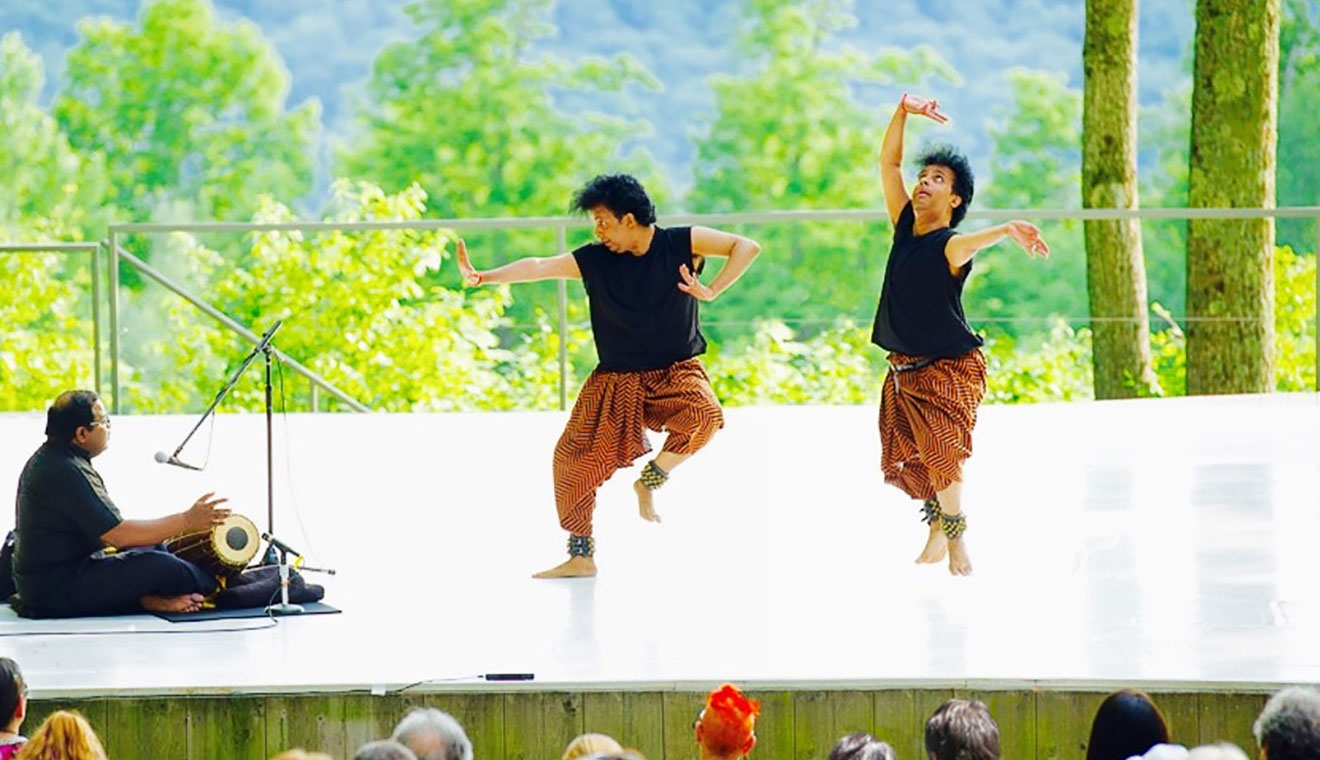 Professor of Dance Hari Krishnan performs in a duet titled “Tiger by the Tail,” which he created for Jacob’s Pillow Dance Festival in 2016. Krishnan is among three dance faculty whose work was featured by Jacob’s Pillow in February. (Photo by Christopher Duggan, photo design by John Elmore)