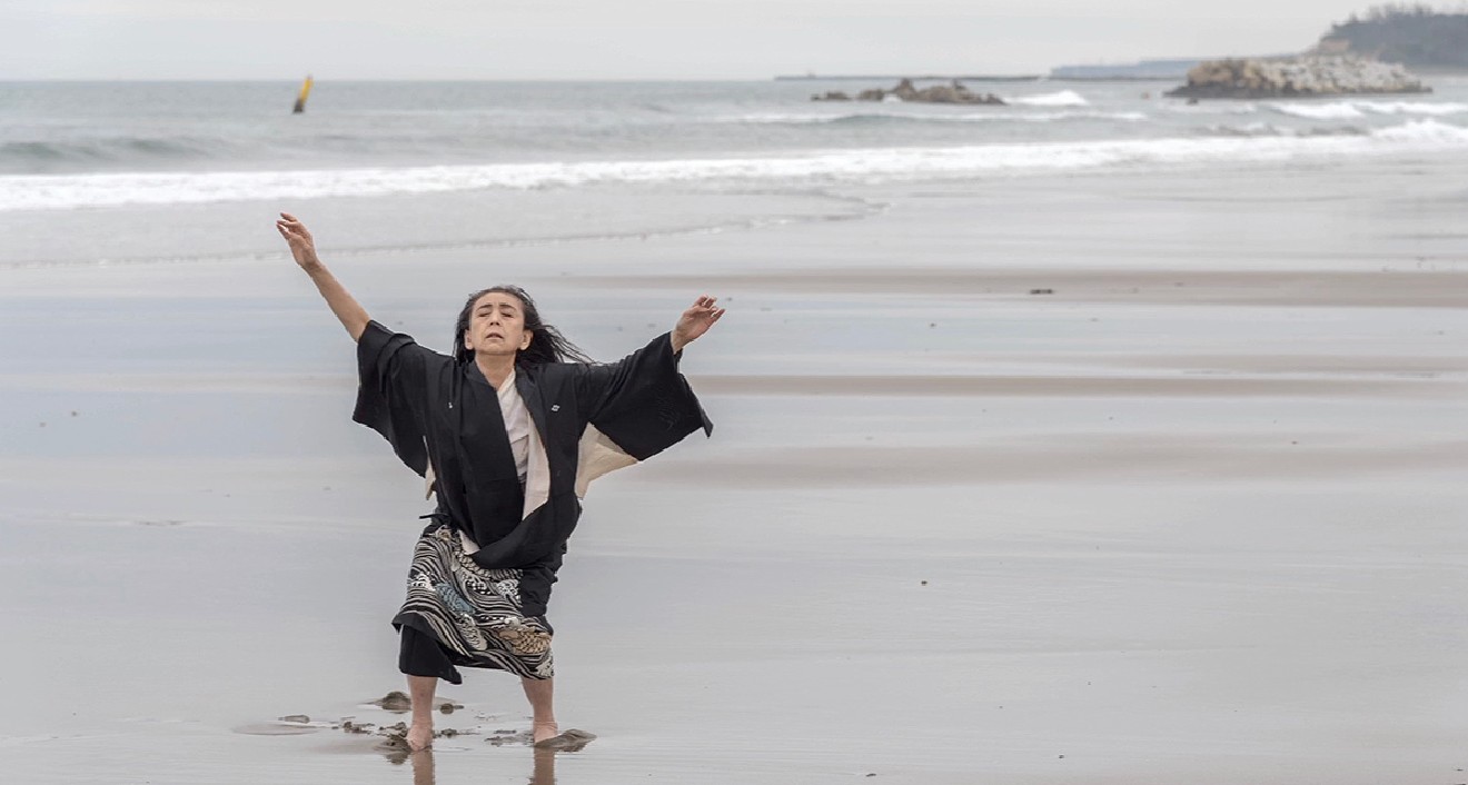 Eiko Otake dances at Ukedo Beach, located four miles north of the disabled Fukushima Daiichi Nuclear Power Plant. (Photo by William Johnson)