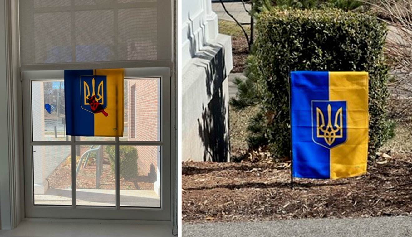 When administrative assistant Ryan Launder saw the COE’s flag, she felt inspired to display a similar flag with the Ukraine coat of arms outside the Shapiro Writing Center. The winds proved too strong, however, so instead, she hung the flag inside the center facing out the window. (Photos by Ryan Launder)