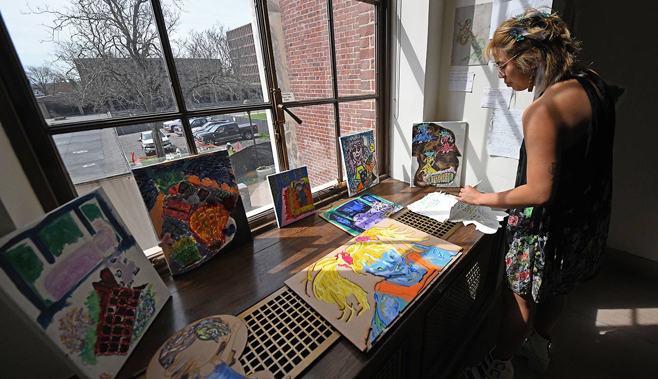 On Olin’s stairwell landing, Lee displayed the story of how “Needle” came to be.