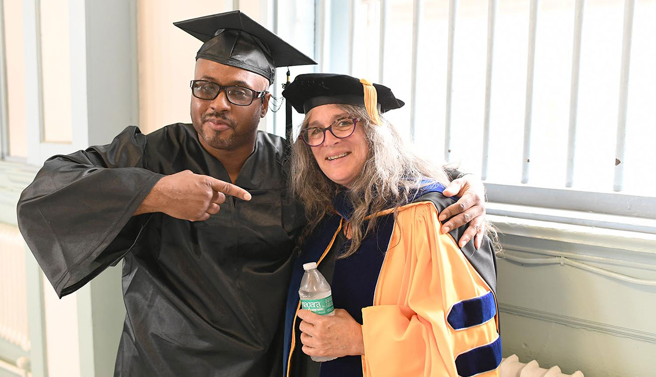 Lori Gruen, William Griffin Professor of Philosophy, pictured here with her former student, Andre, has taught courses for Wesleyan’s Center for Prison Education for more than a decade. This summer, she will resume teaching the classes in-person.