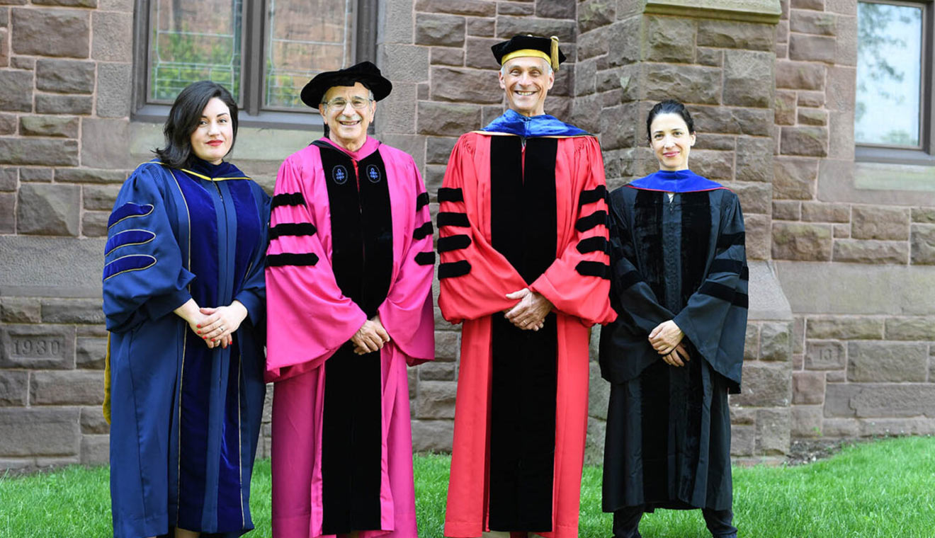 Wesleyan President Michael Roth ’78, third from left, congratulates recipients of the 2022 Binswanger Prizes for Excellence in Teaching. Pictured, from left, Victoria Smolkin, associate professor of history; Frederick M. Cohan, professor of biology; and María Ospina, associate professor of Spanish. (Photo by Olivia Drake)