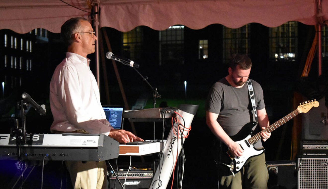 Wesleyan President Michael Roth ’78, at left, sang and played keyboard on a blues tune called “Isolation Blues.”