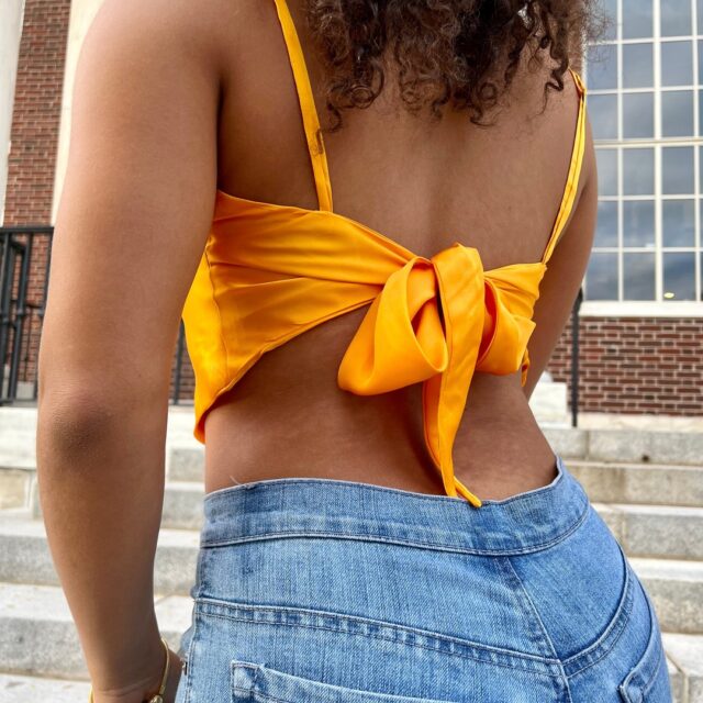 Nimra Karamat ’23 and Ashley Cardenas ’23 created “Aurora”— a Mulberry silk cropped triangle camisole with a self-tie back. The material was grown and woven in Nha Xa Silk Village, Vietnam, and hand-stitched locally in the United States.