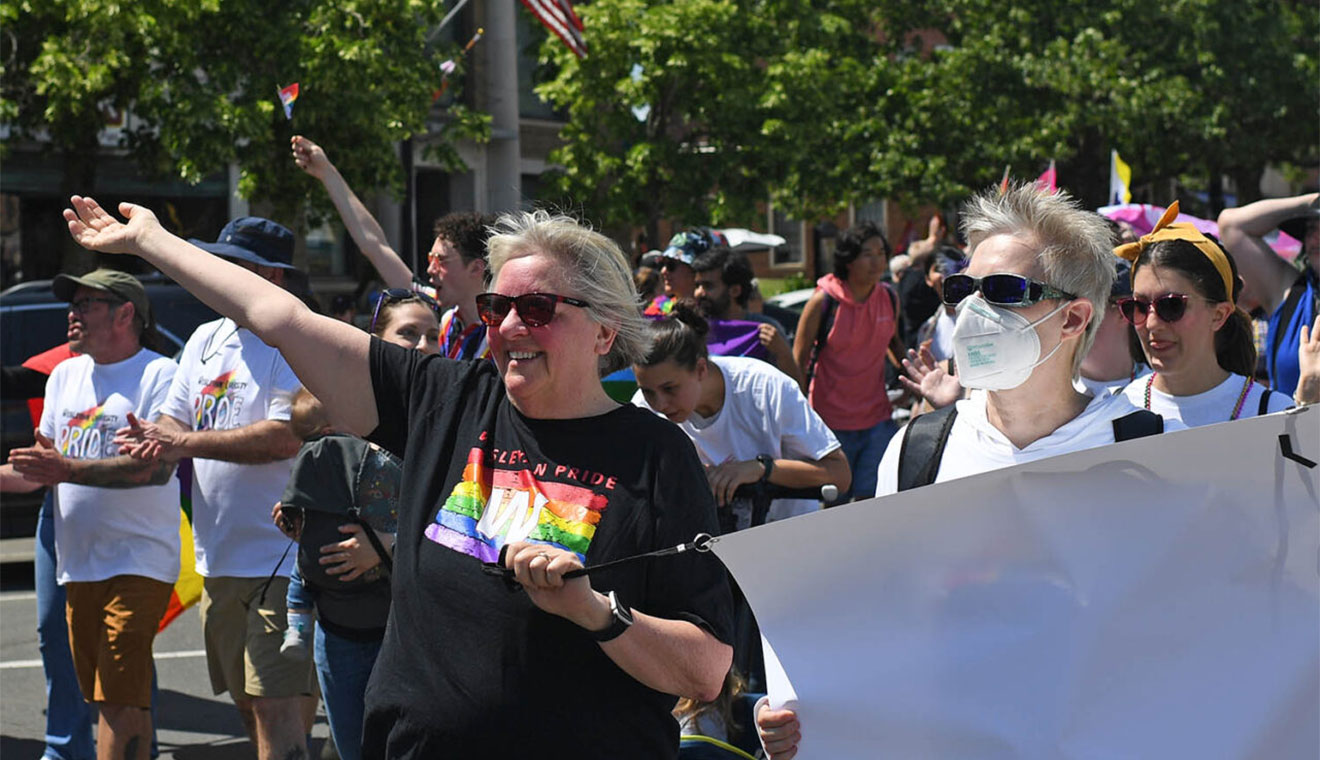 Laura Patey, dean for academic advancement, and Joyce Walter, director of the Davison Health Center, marched in the PrideFEST parade. Wesleyan is a major sponsor of the annual event.