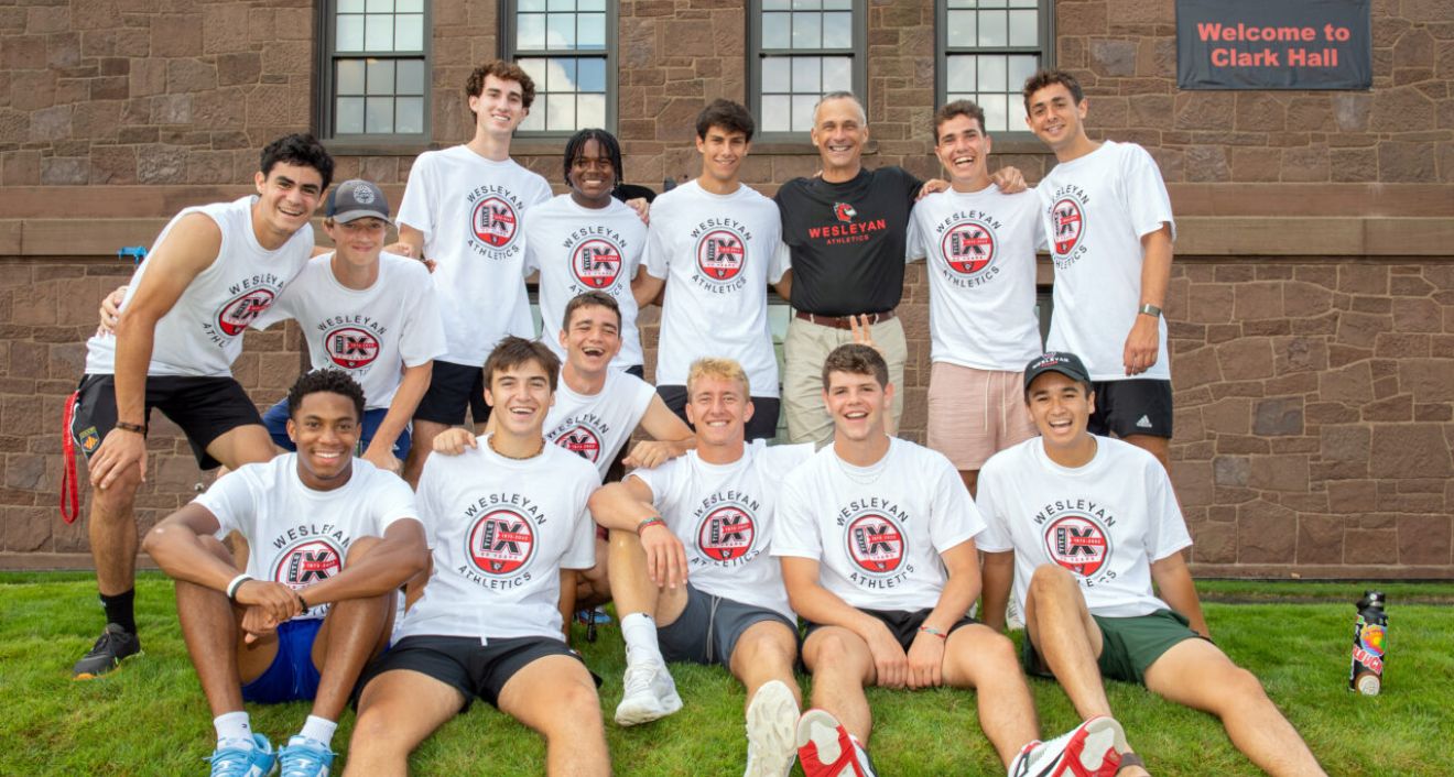 © Photo by Mara Lavitt President Michael S. Roth ’78 greets a groups of student-athletes, whose hard work helping first-years move in contributed to a seamless Arrival Day