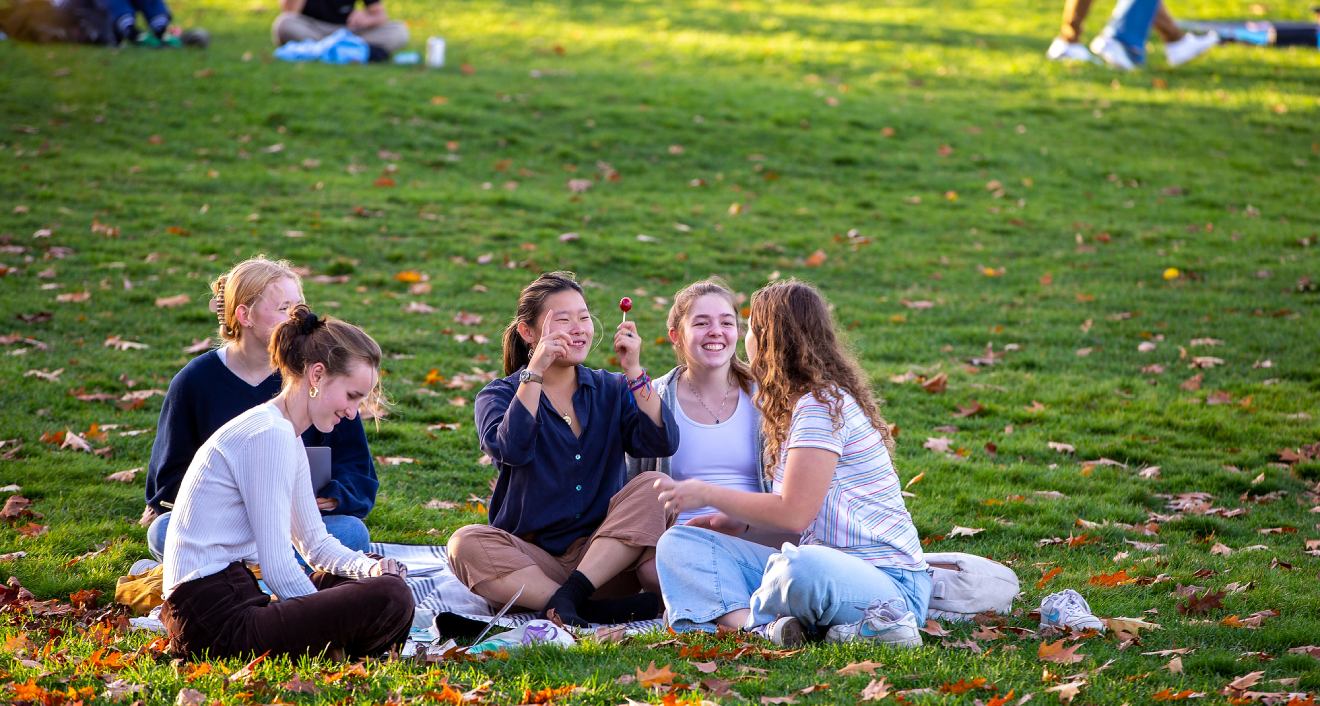 Students relax on Foss Hill during Homecoming and Family Weekend 2022. Photo by Bob Handelman.
