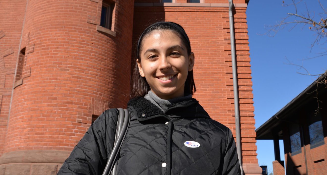 Naya Jorgensen wears an ‘I Voted’ sticker outside of Fayerweather Hall, November 8th, 2022. Photo by Amy Albert