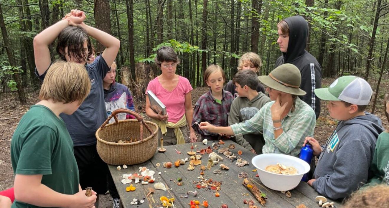 For the last 20 years, Kahn (center) has helped children forage for and identify wild mushrooms in Vermont and New Hampshire.