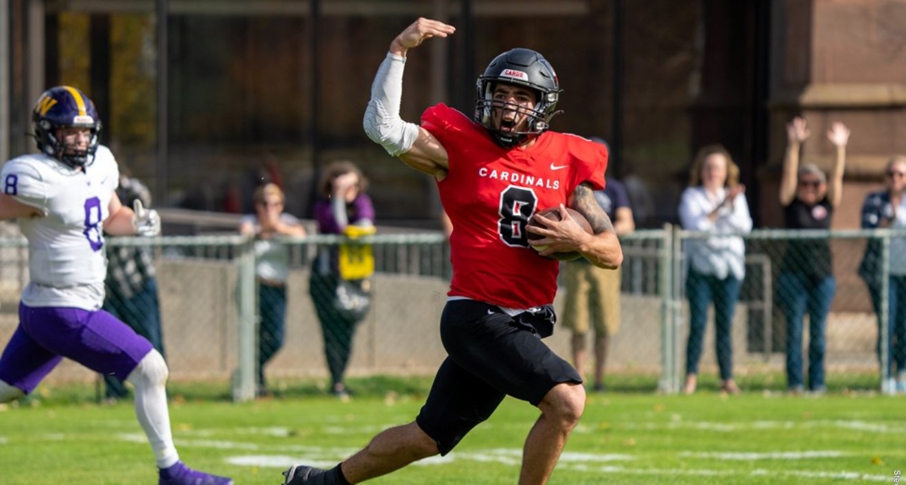 QB David Estevez ’22 looks at his sideline to celebrate at the end of his 78-yard TD run in the first quarter. Photo by Steve McLaughlin.