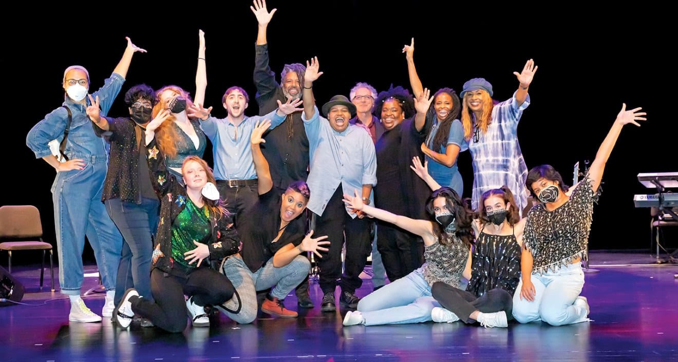Reagon (center) celebrates on stage with fellow musicians, students, and Assistant Professor of the Practice in Dance and African American Studies Joya Powell (far left).