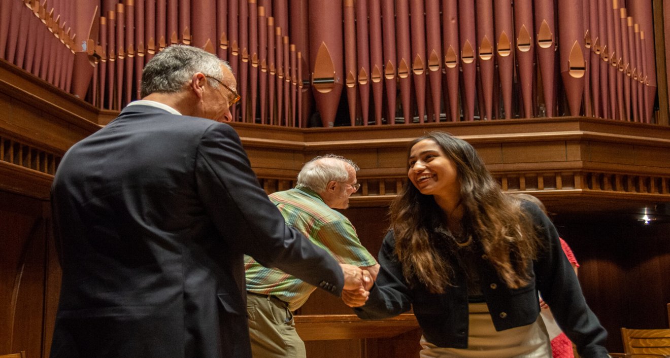 Kaya Zamil ’23 with President Michael S. Roth ’78. (Mike Mavredakis)