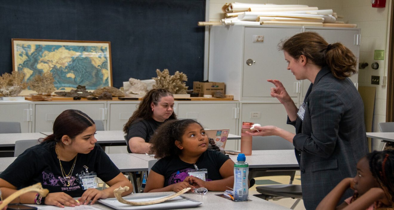 Assistant Professor of Archaeology Katherine Brunson (right) with Girls in Science Camp attendees. (Mike Mavredakis)