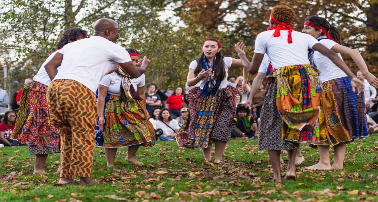 Students dance with Professor of Dance Iddi Saaka before the announcement of Wesleyan’s fundraising initiative. (Meka Wilson)