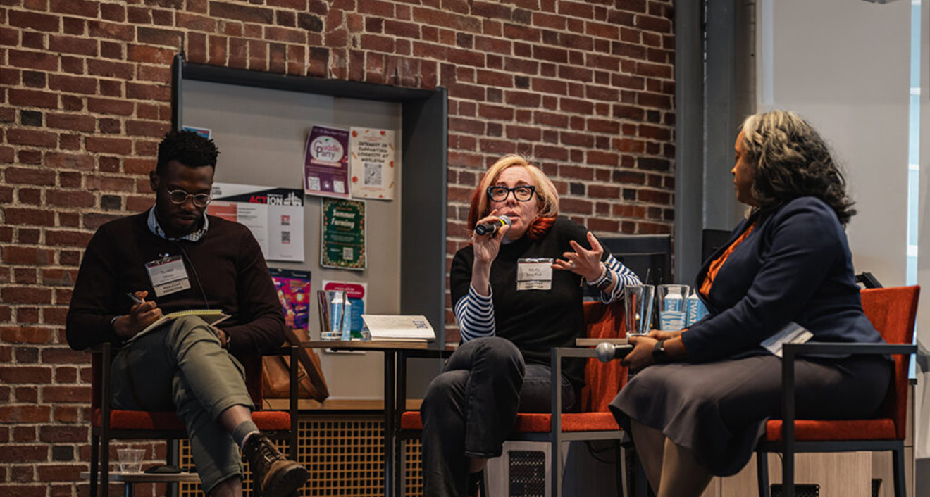 Journalist Molly Jong-Fast speaks at the Media and Democracy panel of the Democracy in Action convening, alongside moderator Steven T. Moore (left), assistant professor of government, and media expert Tracie Potts (right). (Meka Wilson)