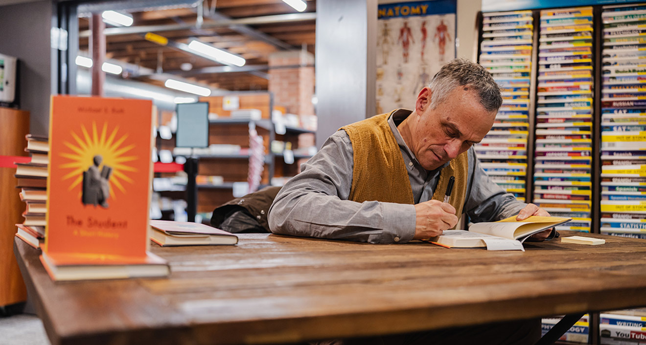 Wesleyan President Michael S. Roth ’78 signing copies of his recent book The Student: A Short History at RJ Julia Booksellers. (Photo by Meka Wilson)