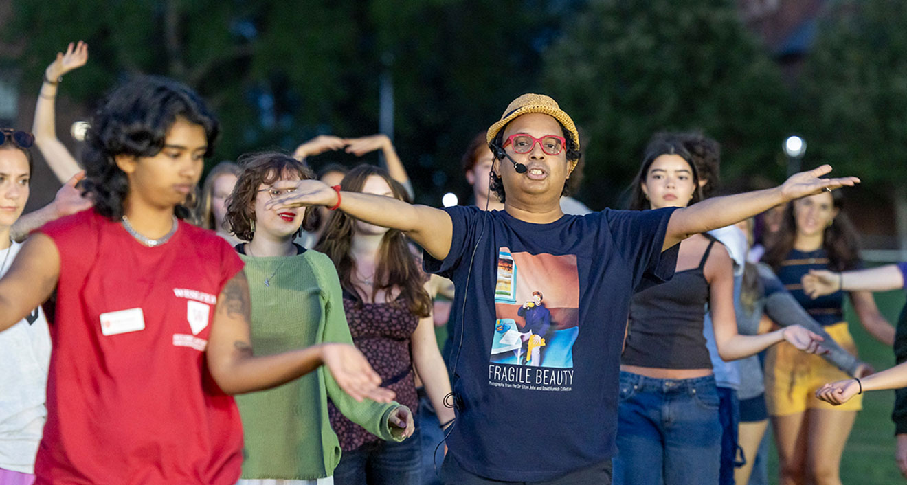 Professor of Dance, Global South Asian Studies, and Feminist, Gender, and Sexuality Studies Hari Krishnan (center) instructs students at the Common Moment on Aug. 30. (Photo by Sandy Aldieri of Perceptions Photography)