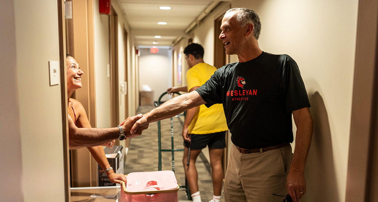 President Michael S. Roth ’78 greets a parent on Arrival Day, Aug. 28. (Photo by Meka Wilson)