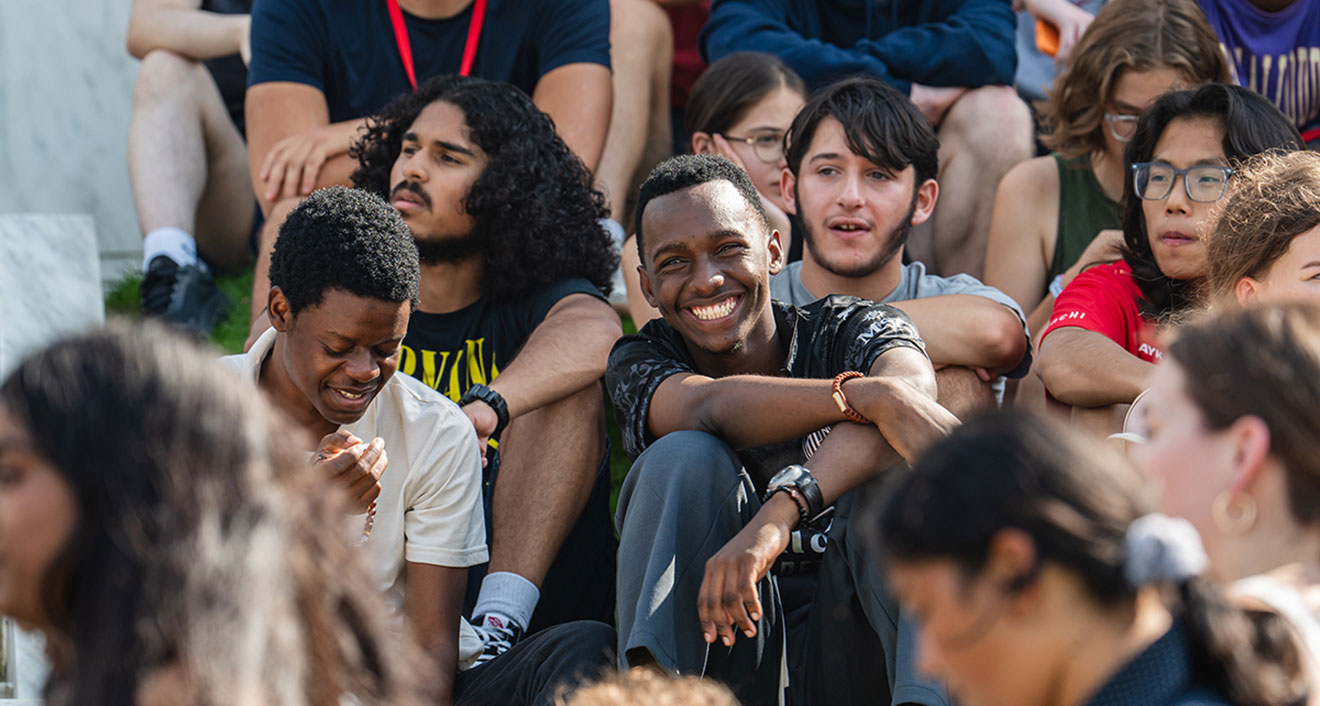 Students from the Class of 2028 sit on the lawn outside Olin Memorial Library on Arrival Day. (Photo by Meka Wilson)