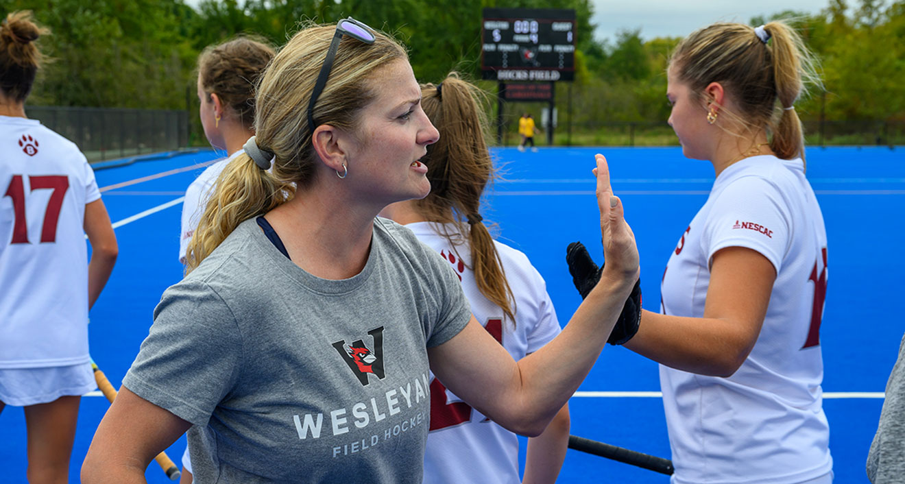 Wesleyan Field Hockey Head Coach Christine Kemp during post-game handshakes. (Photo by Steve McLaughlin)