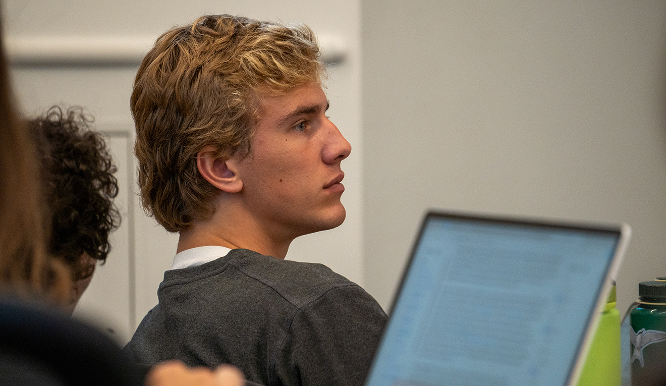 A student listens during the Government Department’s panel on a potential transfer of power in the upcoming election. (Photo by Mike Mavredakis)