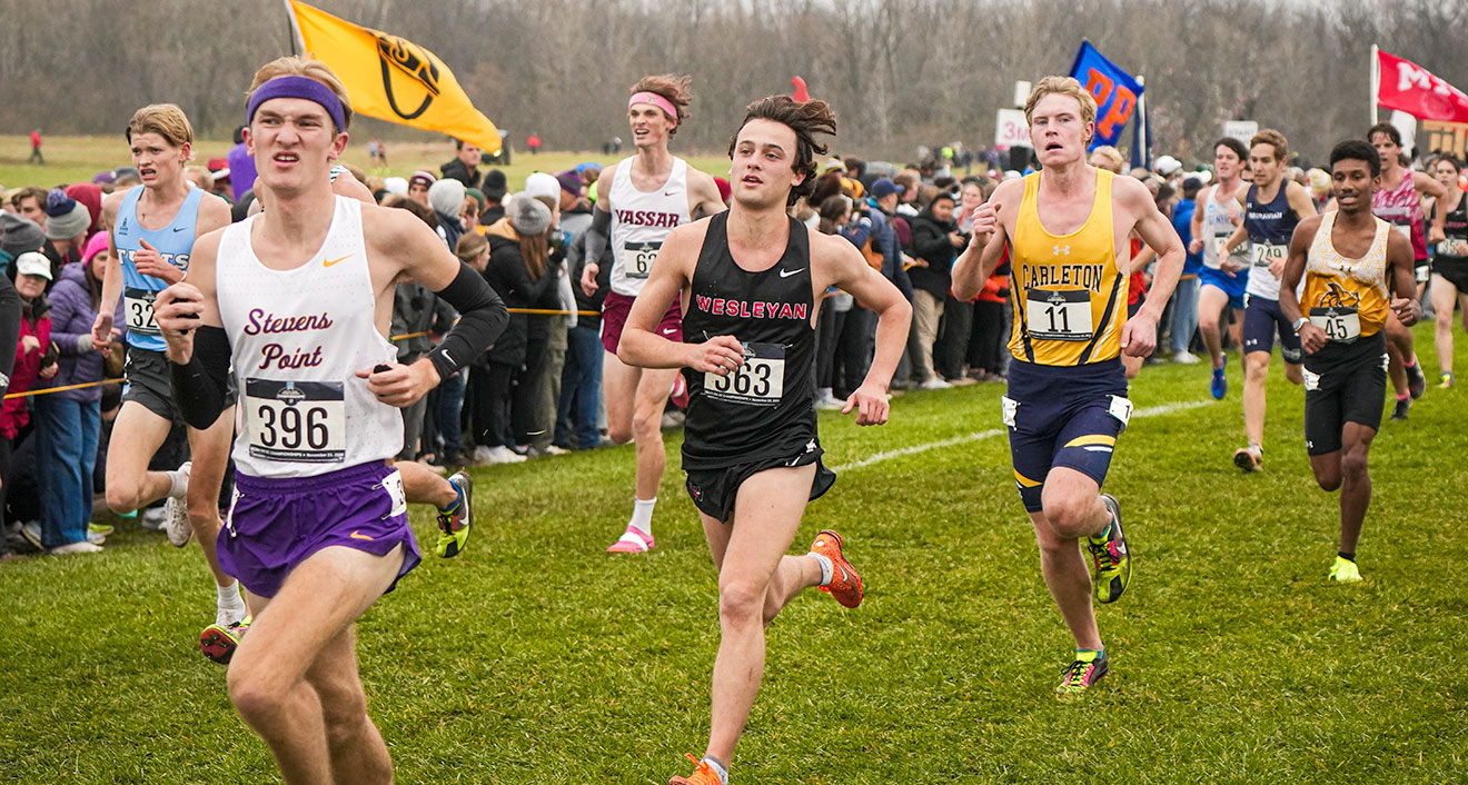 Aidan Mahoney ’27 (middle) runs at the NCAA Championships on Nov. 23. (Photo by Brandon Tomory)