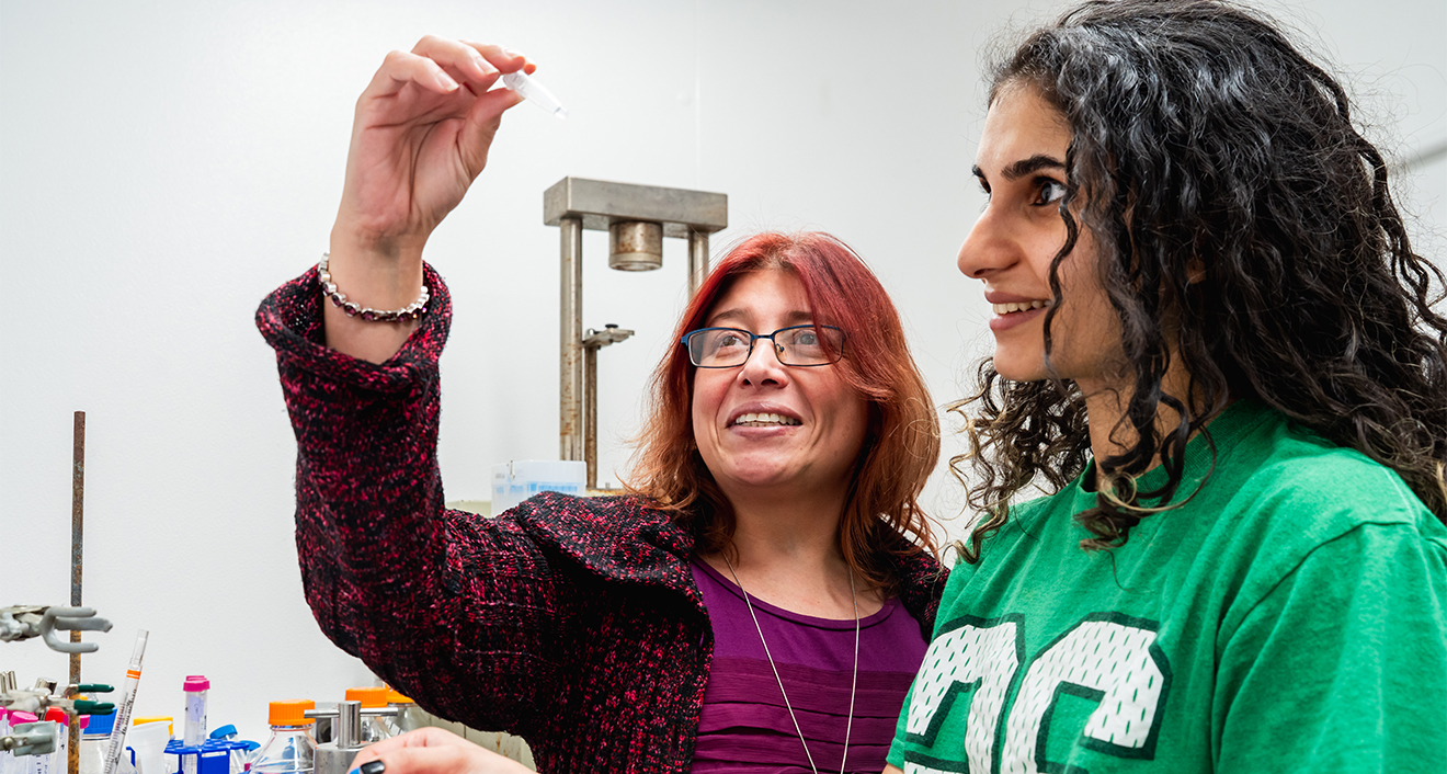 Assistant Professor of Molecular Biology and Biochemistry Teresita Padilla-Benavides, left, and a student, right, in Padilla-Benavides’ lab. (Photo by Meka Wilson)