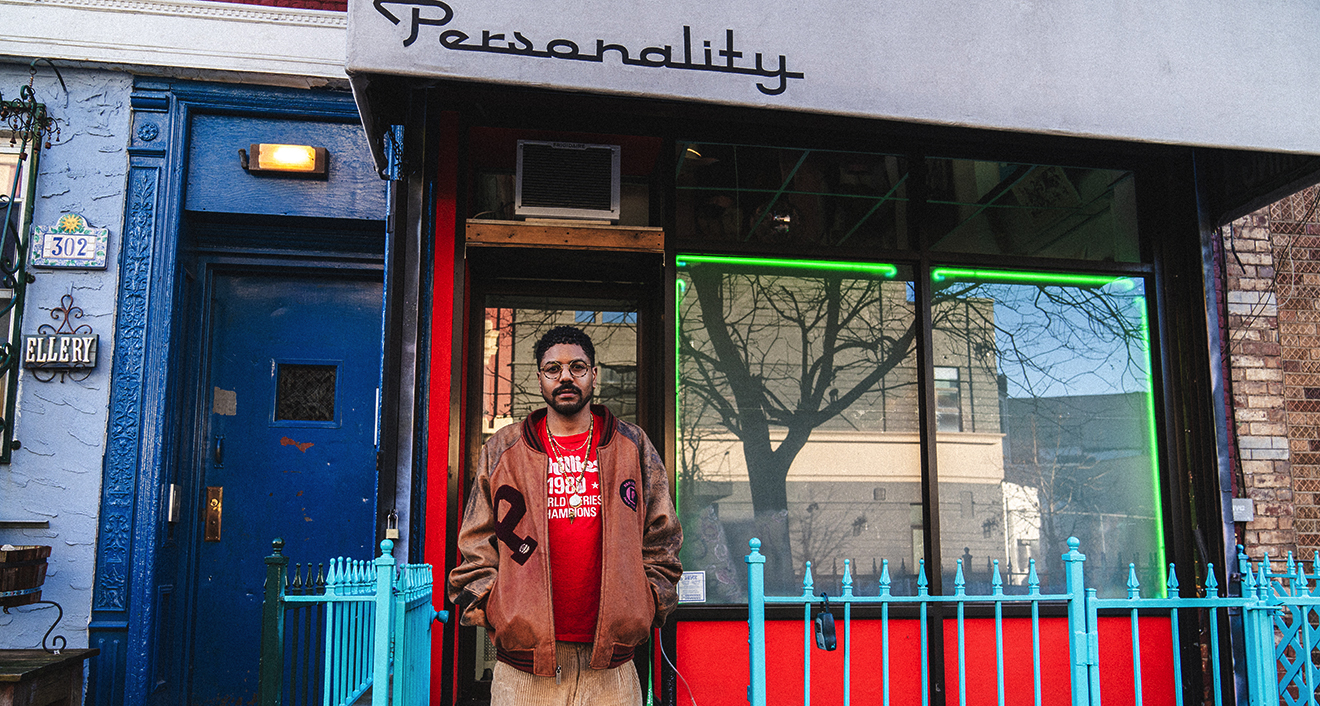man in front of laundromat
