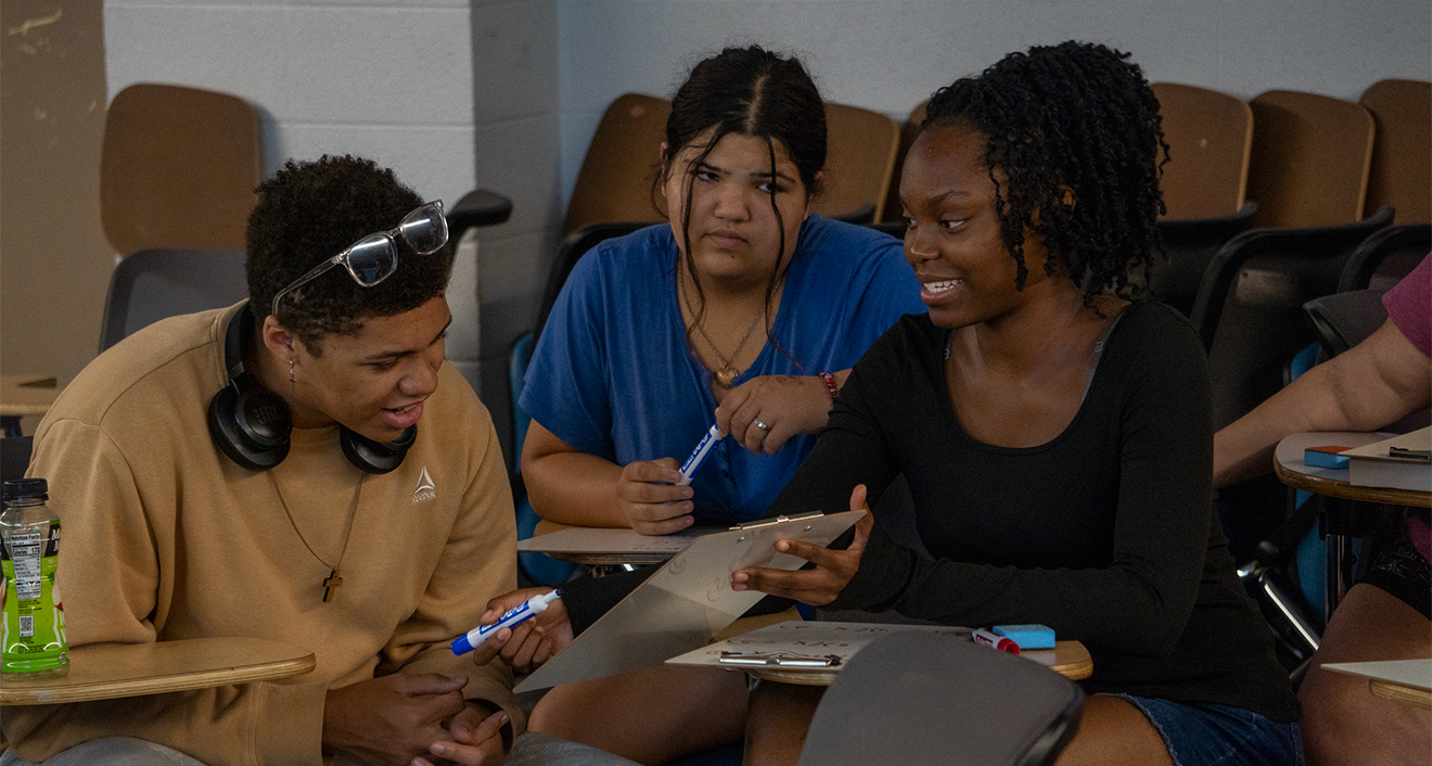 Three UB students in their summer math class.