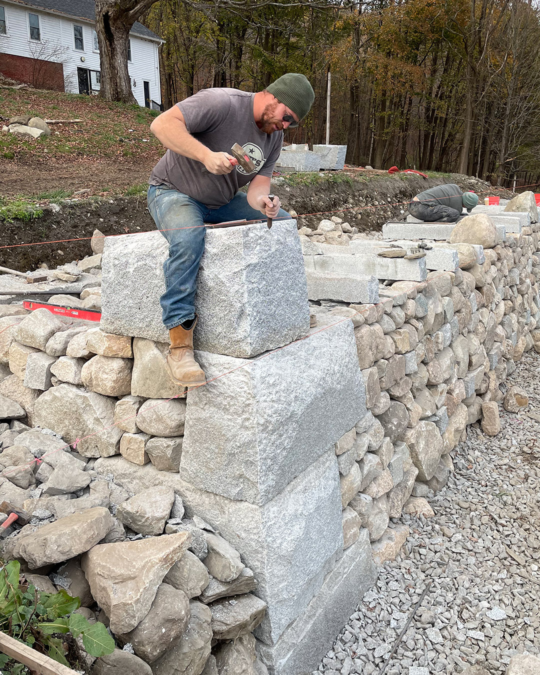 stone mason with chisel