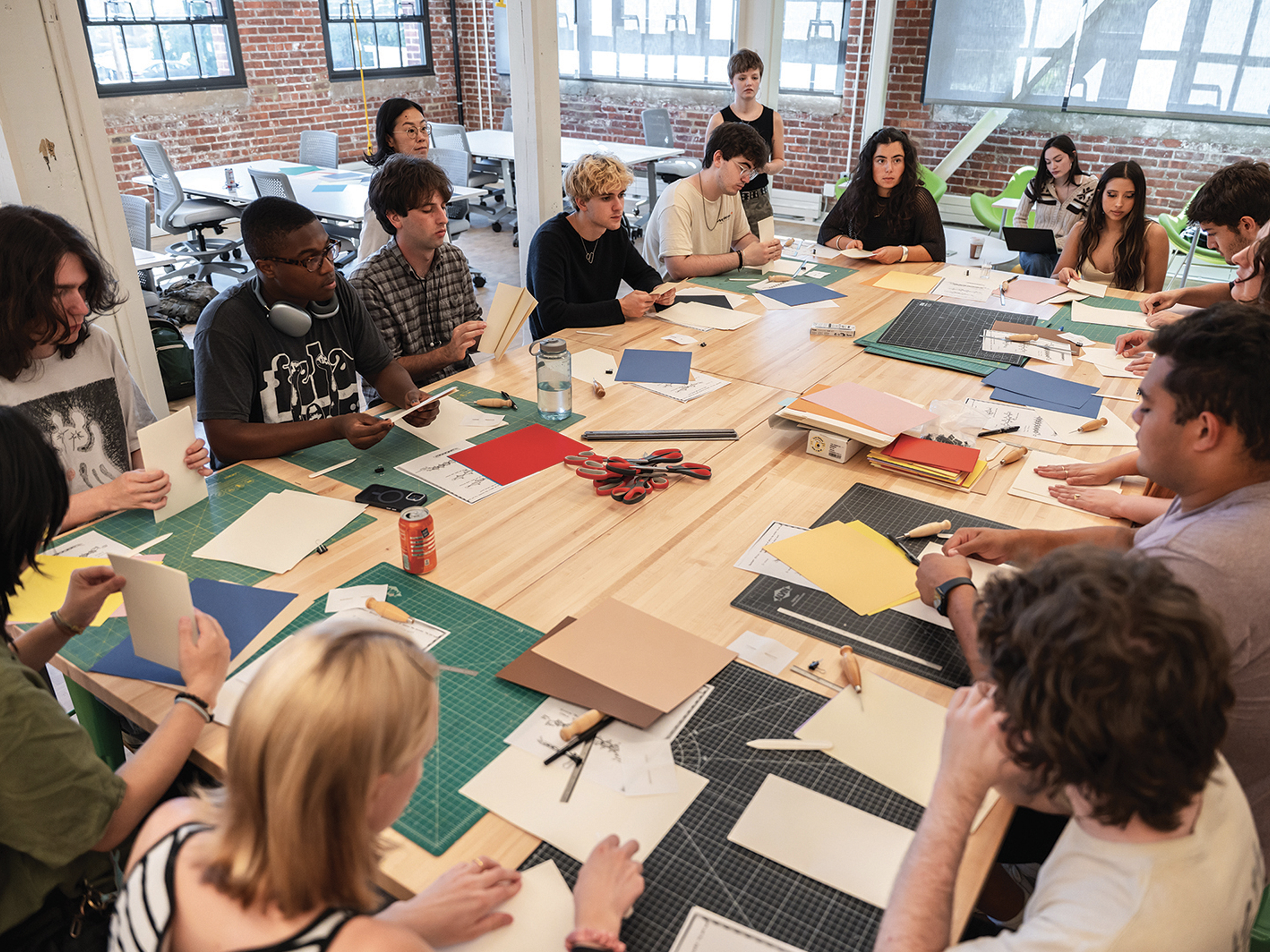 students around a large table in the Design Studio