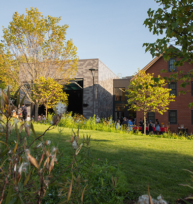 Exterior of art building with grass and trees