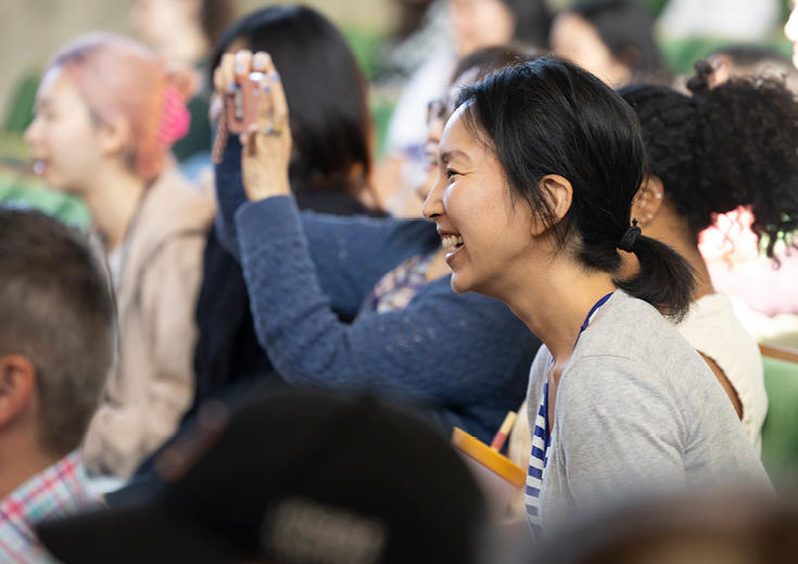 Seated audience members enjoying a workshop
