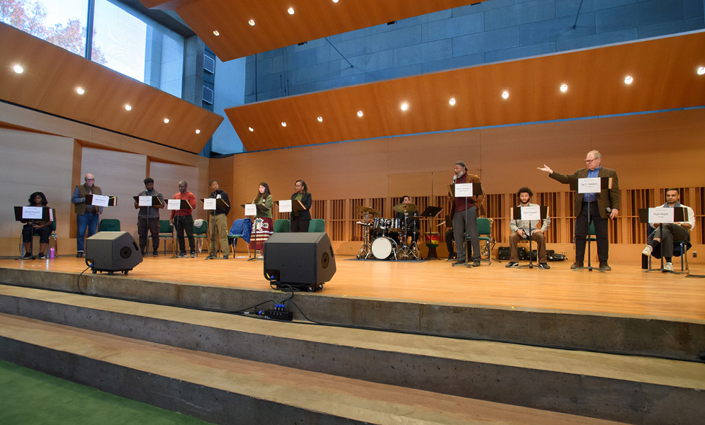 Actors speaking on stage