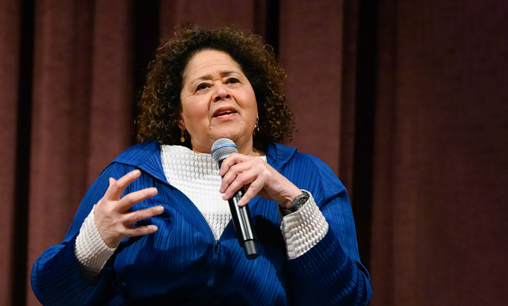 Artist speaking on stage