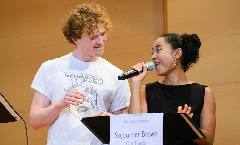 Actors speaking on stage