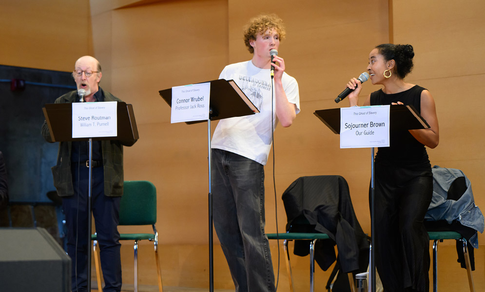 Actors speaking on stage