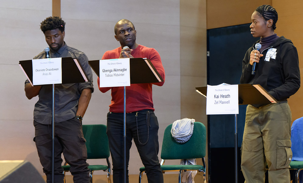 Actors speaking on stage