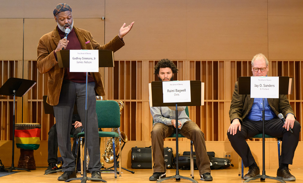 Actors speaking on stage