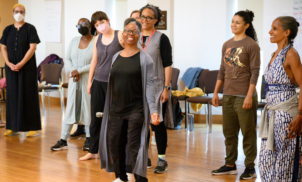 People standing in room smiling