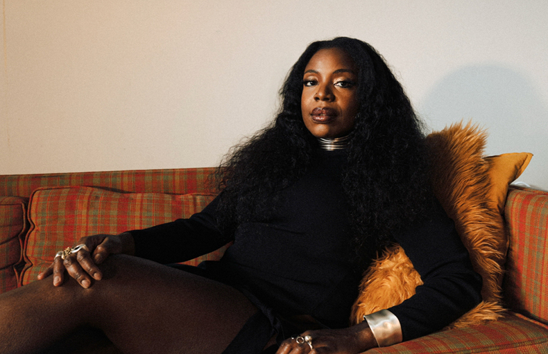 Melanie Charles on couch
