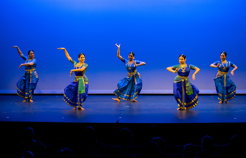 Kalanidhi Dance Ensemble performing on stage. 
