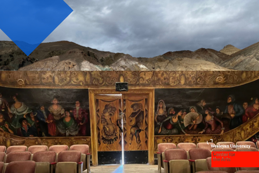 Theater with seats and mural and desert landscape above