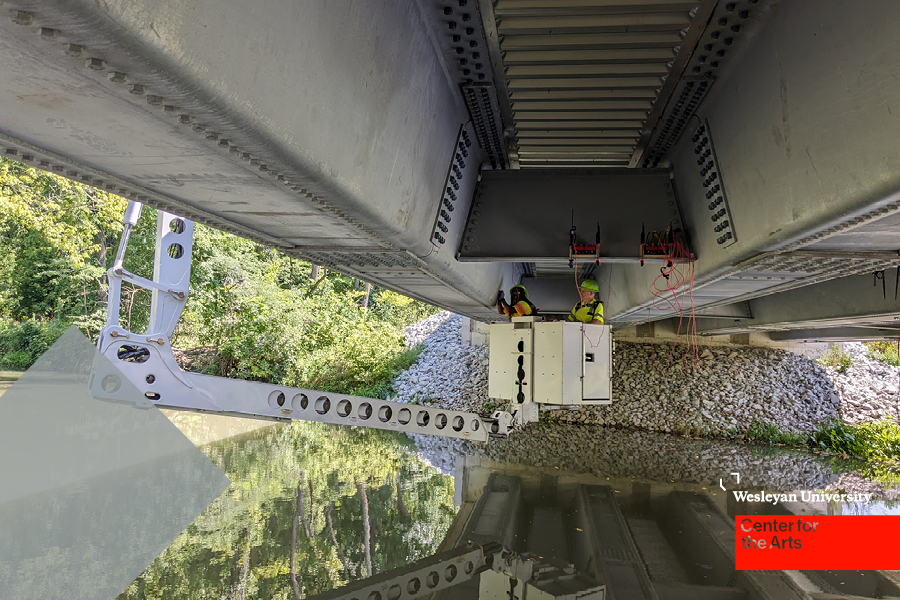 two people in lift under bridge