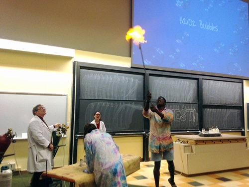 Jacques Bazile '16 ignites bubbles of hydrogen and oxygen, assisted by Lexie Malico '16, Sarah Briggs '16, and Professor Westmoreland